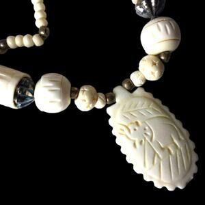 Hand-carved bone necklace, India, Elephant pendant